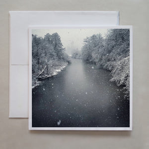 A greeting card photograph taken from a bridge over-looking the Langley River during a snow fall by photographer Jennifer Echols.